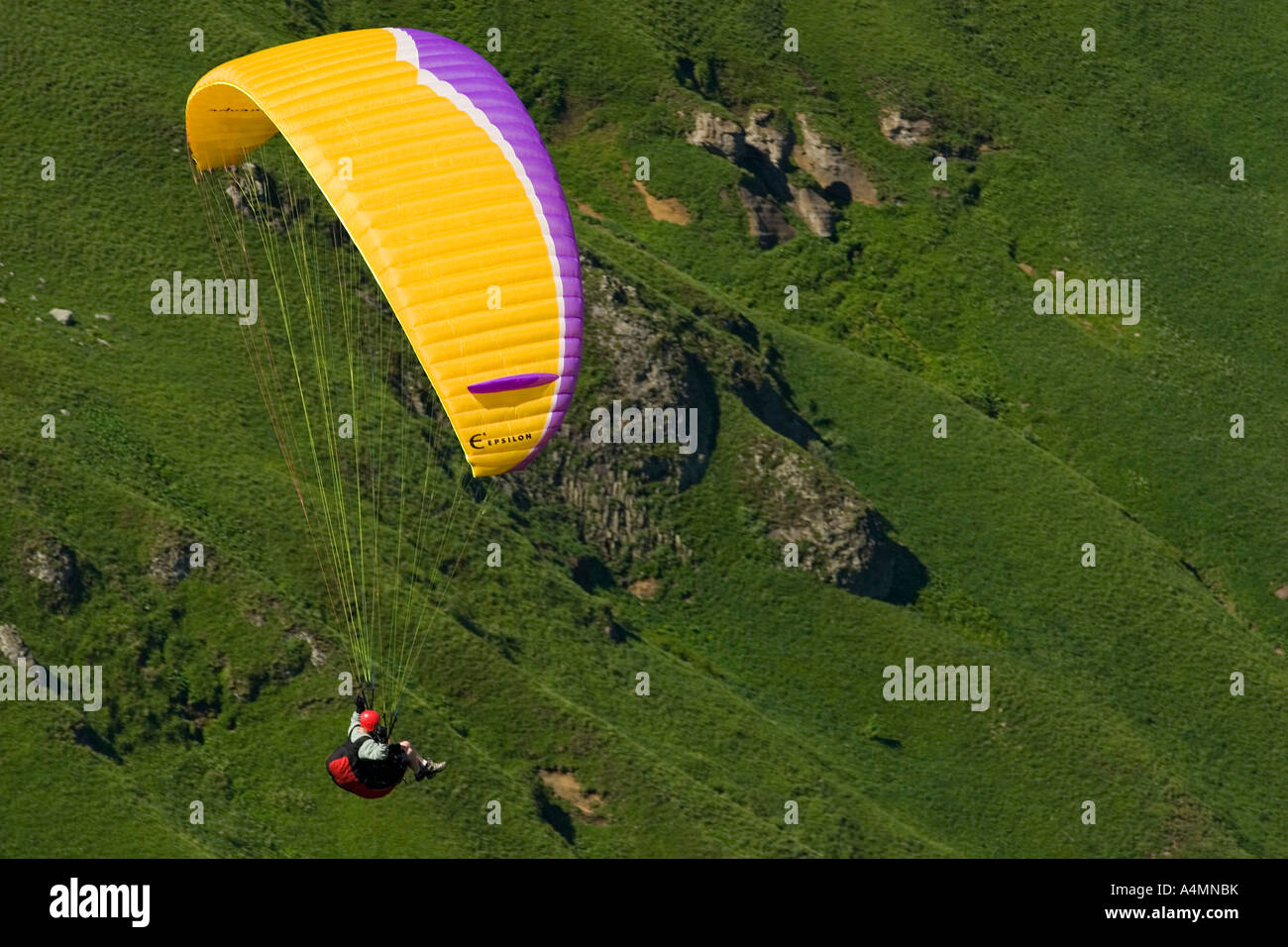 Paragliding over the Sancy Massif (Puy de Dôme - France). Parapentiste en vol dans le Massif du Sancy (Put de Dôme - France). Stock Photo