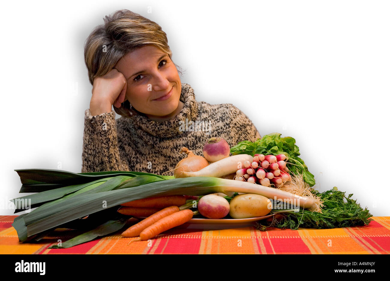 Young Lady proud of her organic vegetable harvesting. Jeune femme fière de sa récolte de légumes biologiques. Stock Photo
