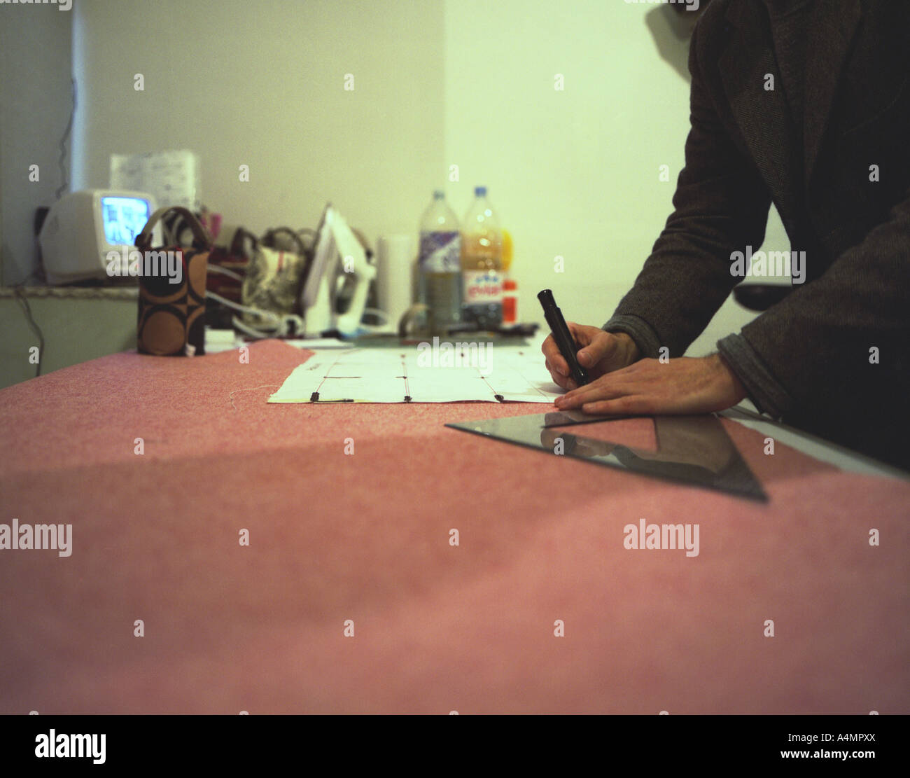 Marking out fabric for cutting Stock Photo Alamy