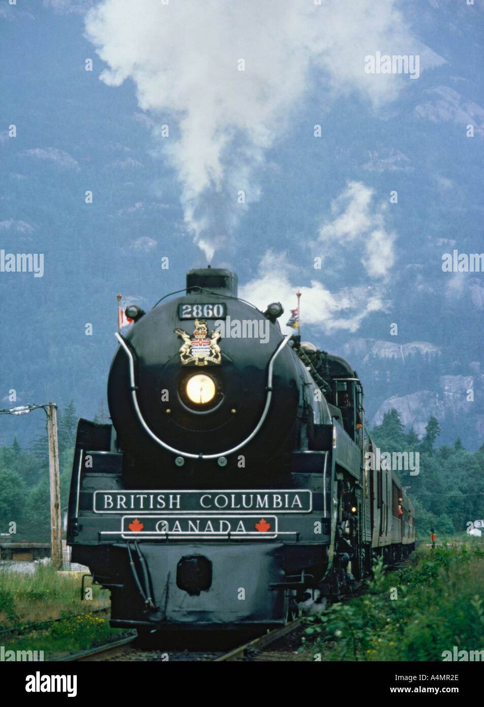 Dramatic full frontal low angle viewpoint of the restored black Royal Hudson Steam Train near Vancouver Canada Stock Photo