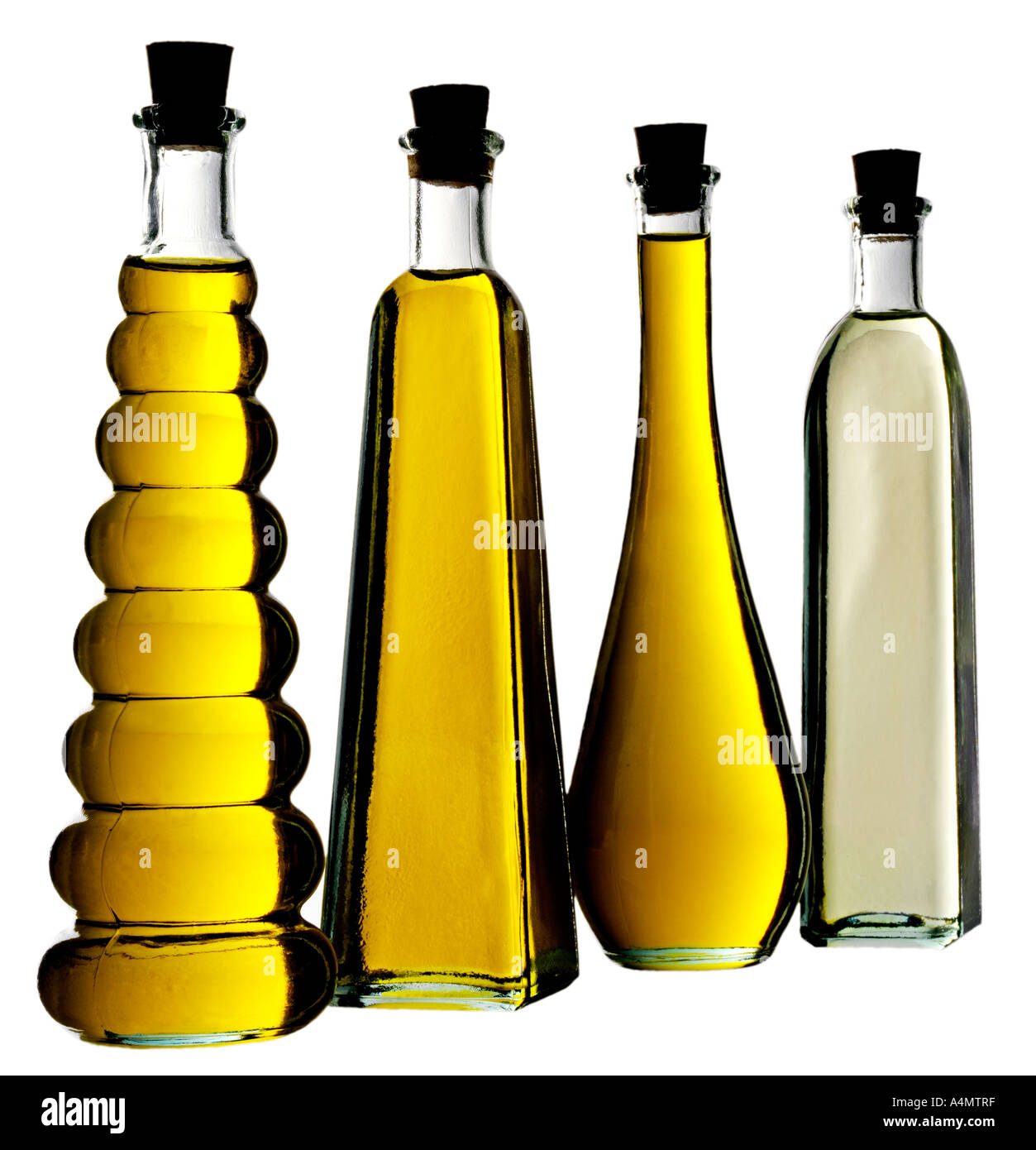 FOUR OIL BOTTLES CUT OUT Stock Photo