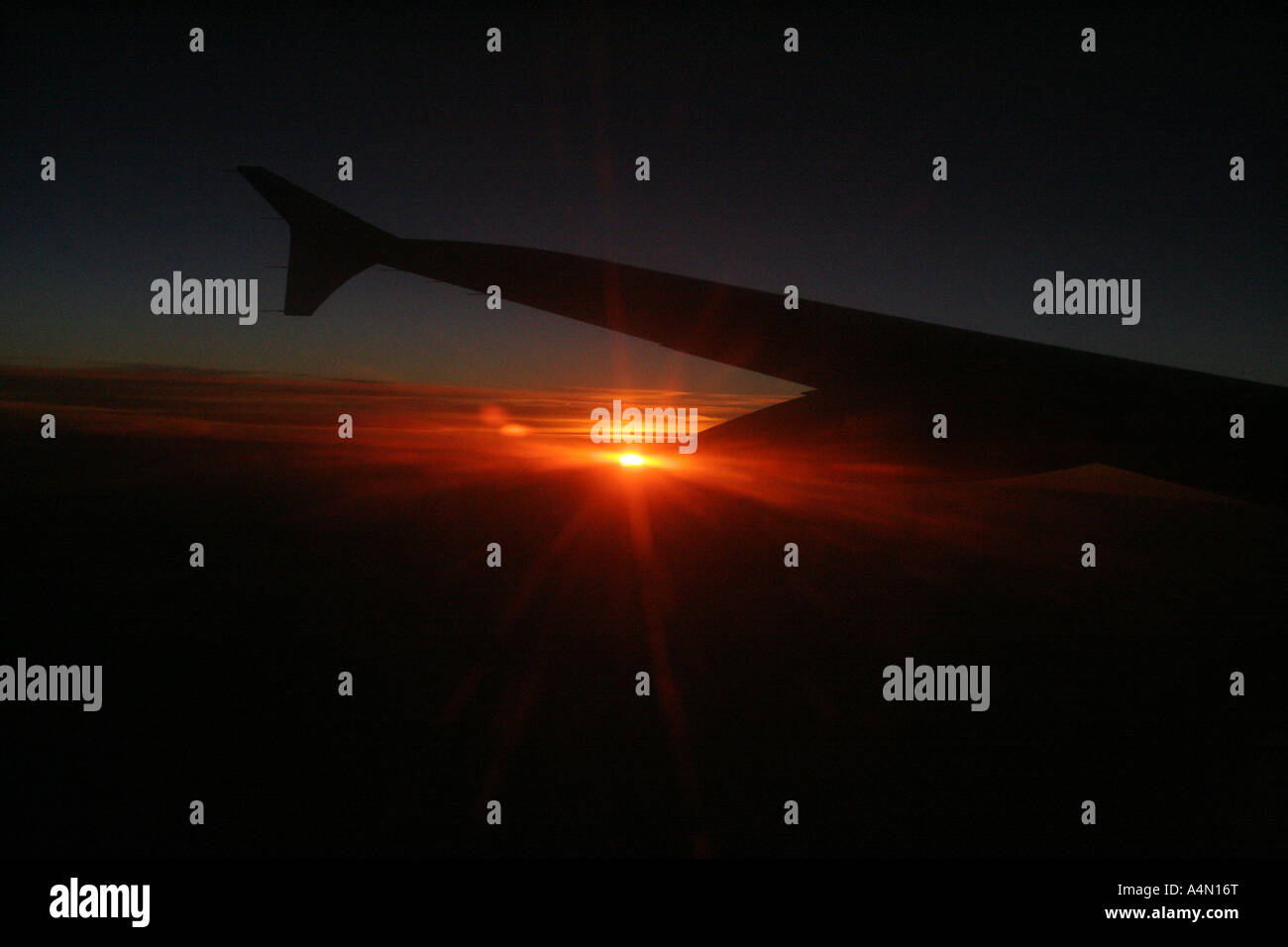 Airbus A319 wing at dawn with sunburst. Landscape, horizontal, full ...
