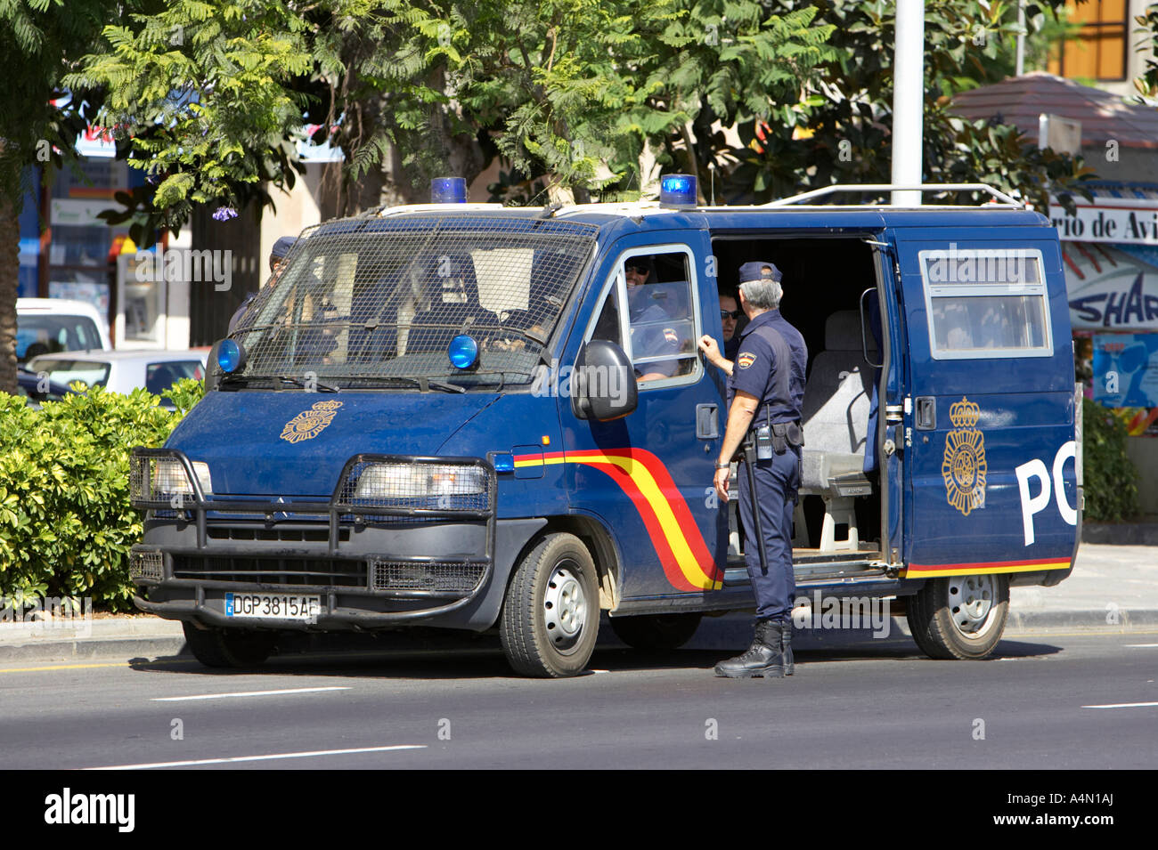 spanish riot police officers in blue police van in Santa Cruz Tenerife Canary Islands Spain Stock Photo