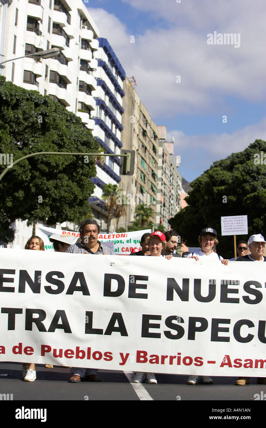 Spanish protesters demonstrate walking with wide spanish language banner in Santa Cruz Tenerife Canary Islands Spain Stock Photo