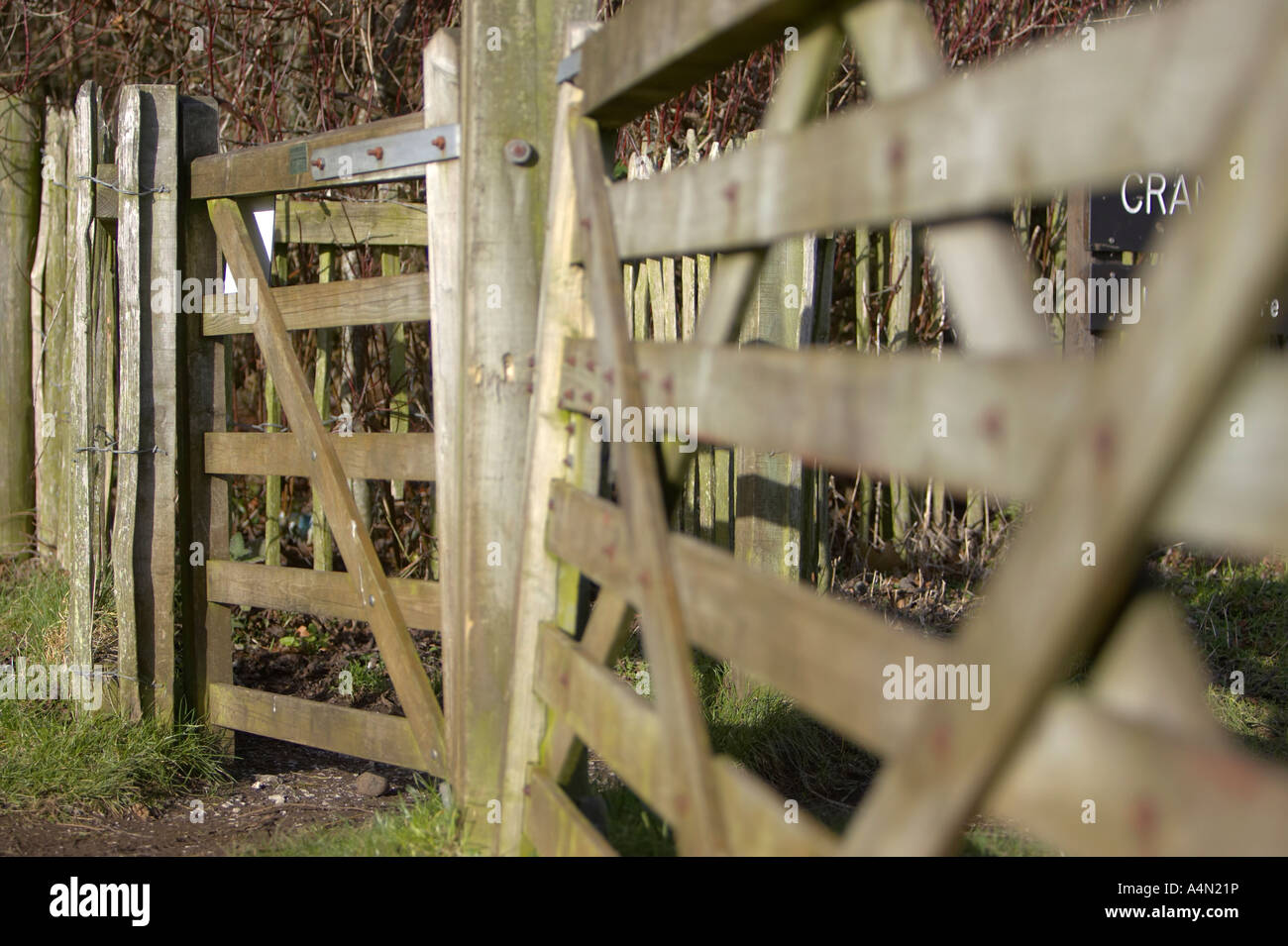close up of wooden swivel pedestrian gate entrance and wooden field gate in carnlough county antrim Stock Photo