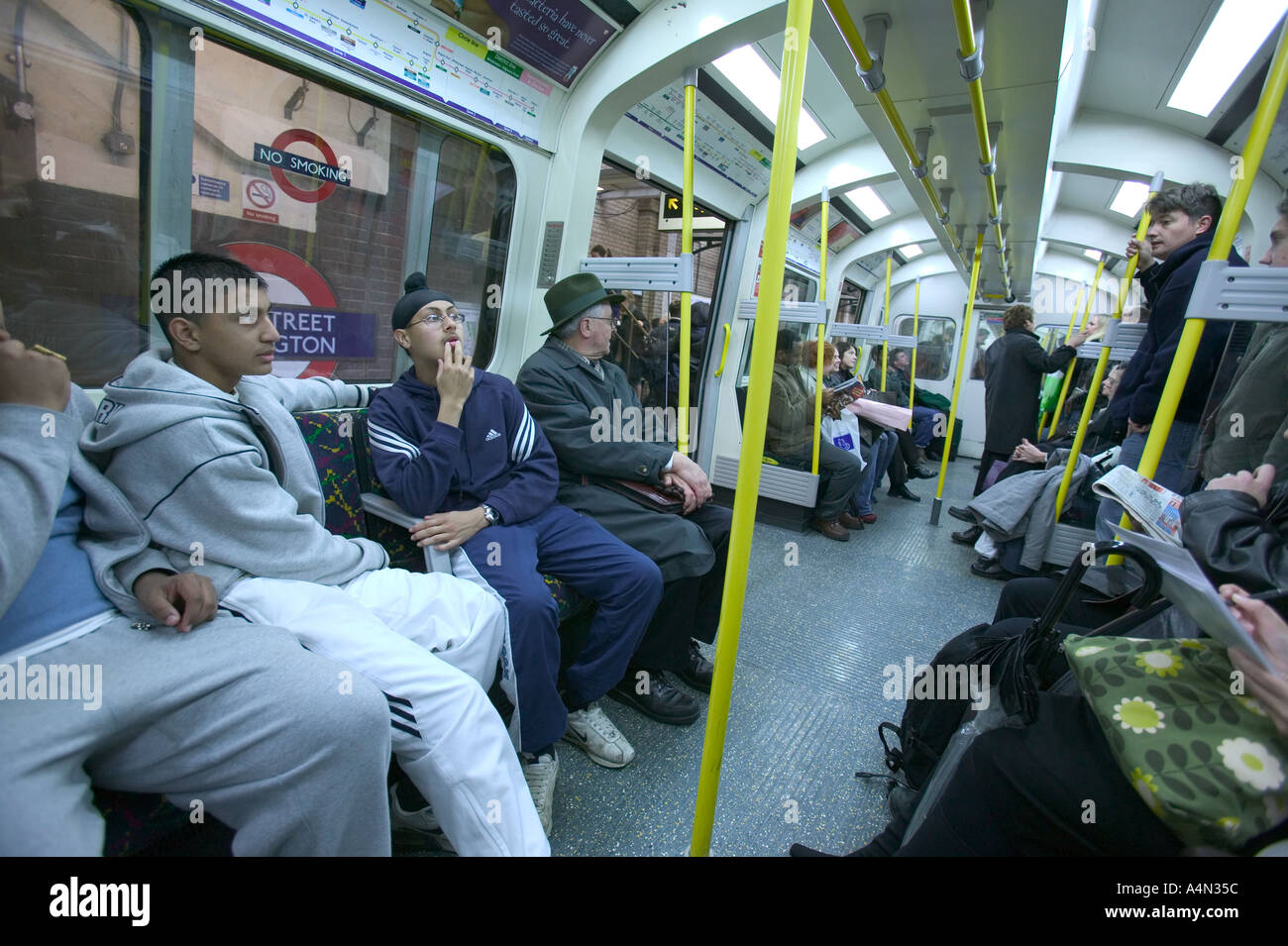 commuters on tube train Stock Photo Alamy