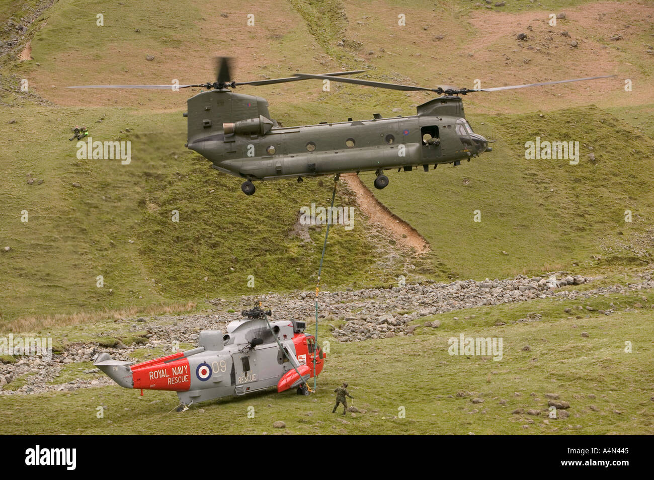 Chinook helicopter airlifting a crashed sea king helicopter Langdale