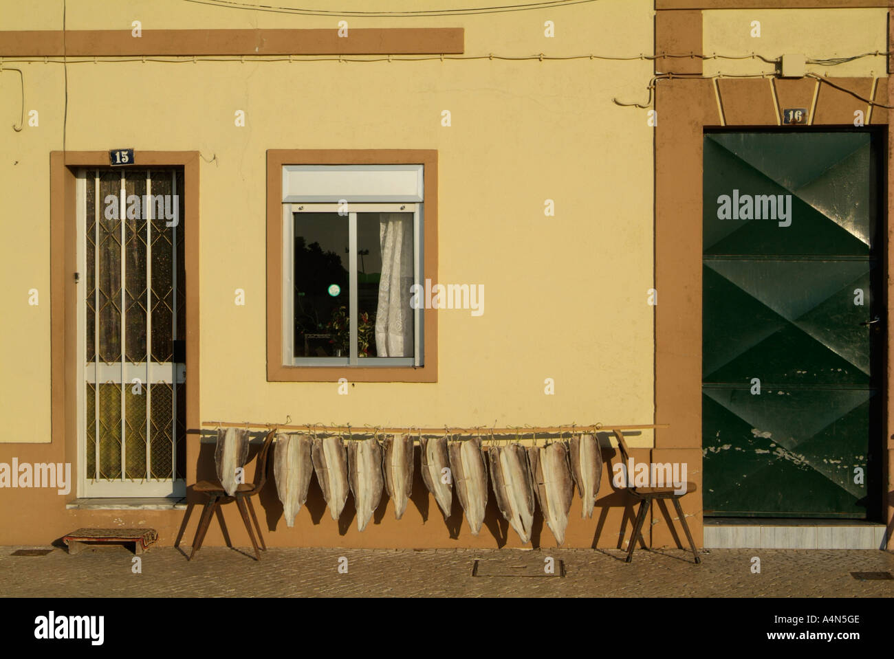 Drying cod fish in a street of Portugal Stock Photo Alamy