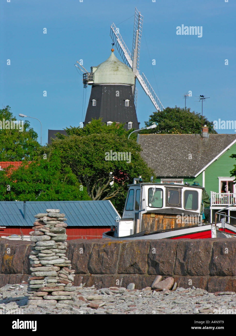 Sandvik little fisher village with old Dutch windmill on the western