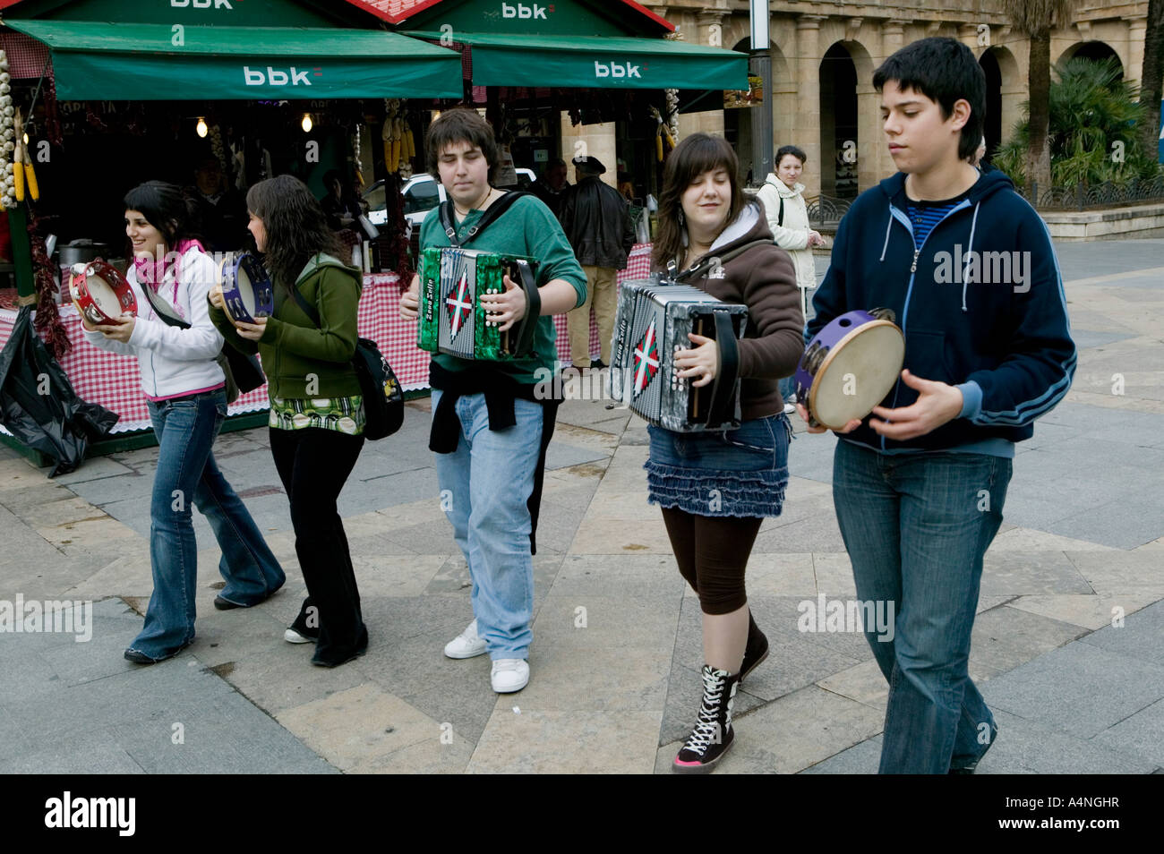 Group of young people play traditional Basque musical instruments, Plaza Nueva, Bilbao Stock Photo