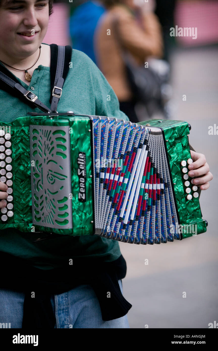 Young Basque man playing traditional Basque accordion, Plaza Nueva, Bilbao Stock Photo