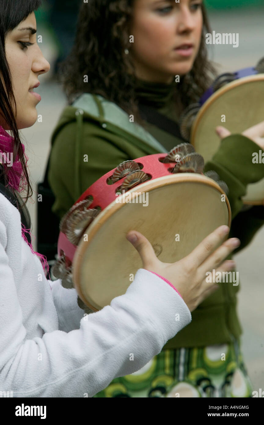 Two young Basque women playing the tambourine, Plaza Nueva, Bilbao Stock Photo
