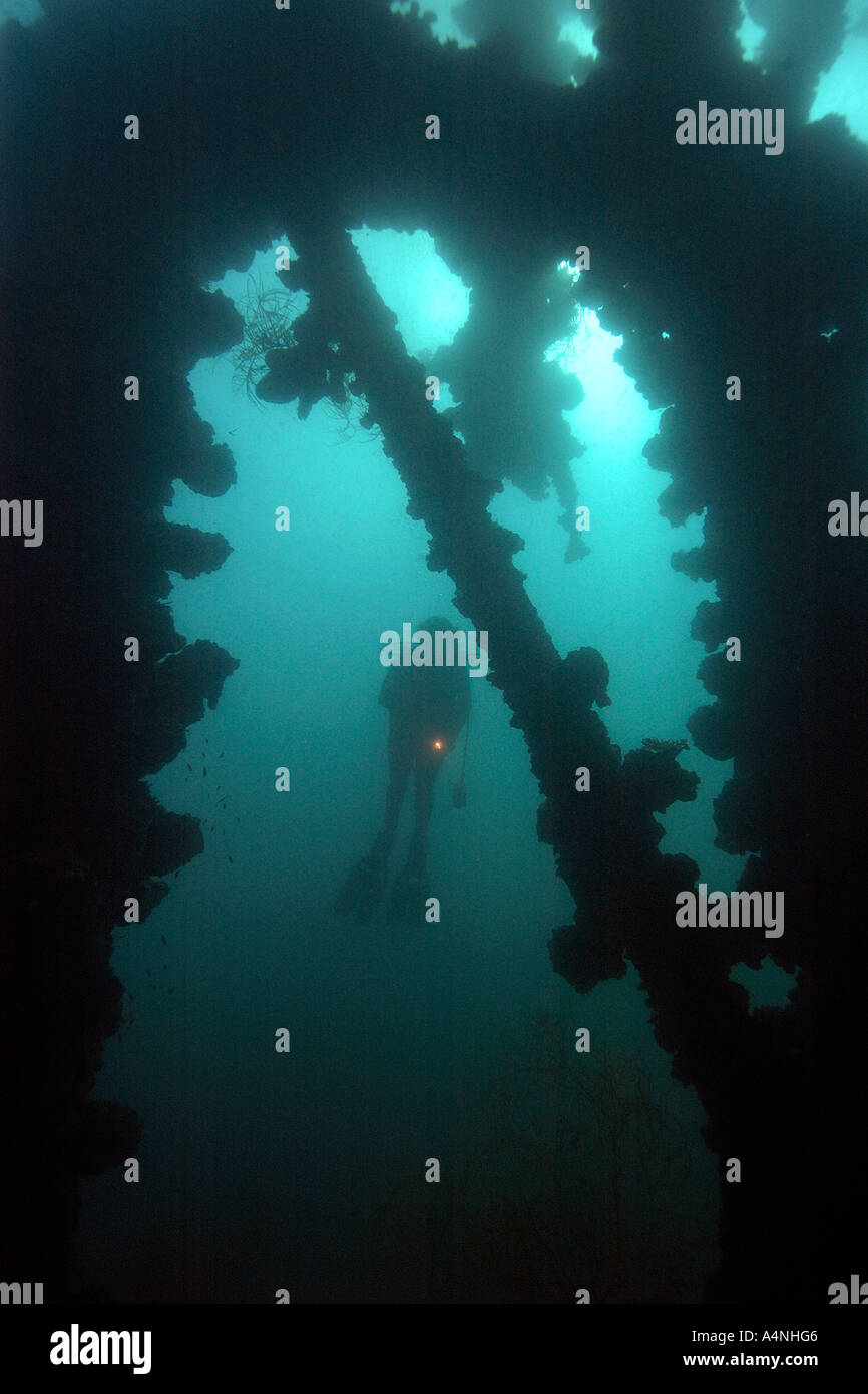 Diver silhouette on Iro Maru ship wreck a Japanese support ship sank in