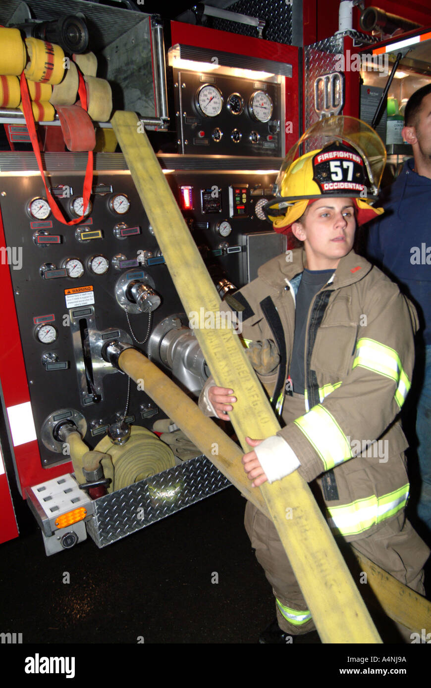Firefighter pulling a hose hi-res stock photography and images - Alamy
