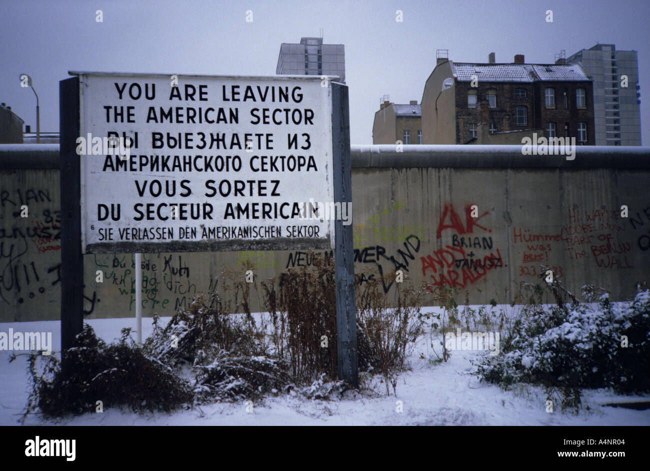 Berlin Wall in 1984. Sign you are leaving the American sector. Iron Curtain during the Cold War Stock Photo