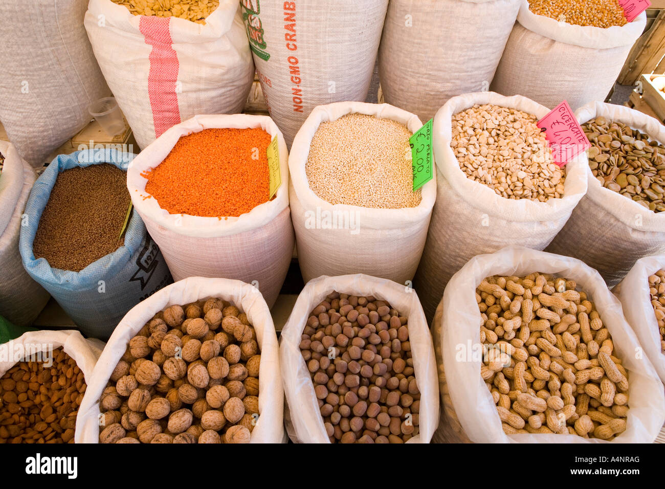 Nuts seeds and pulses for sale in a market stall Cisternino Puglia