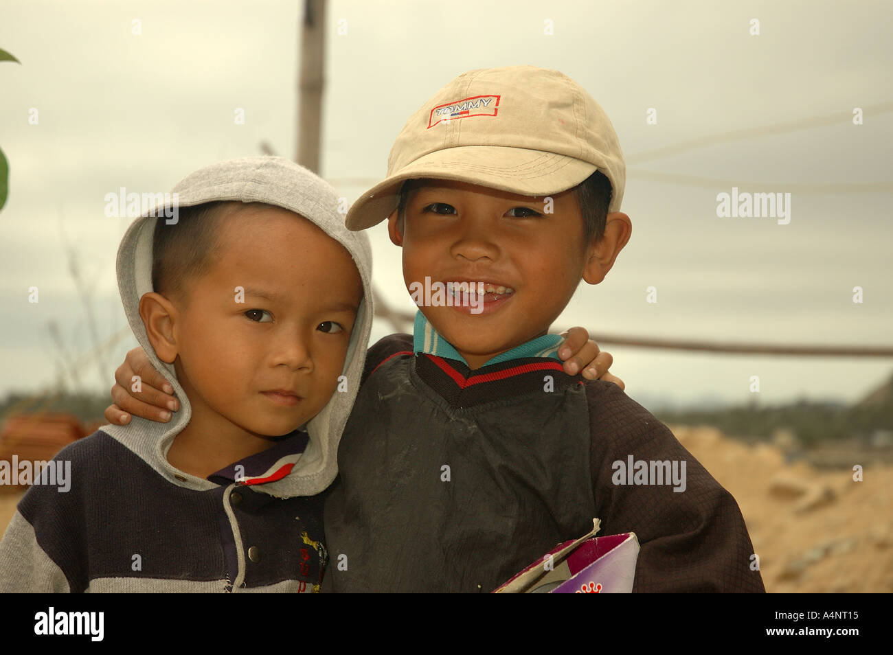Two small boys kids at a fishing village coastal Vietnam South