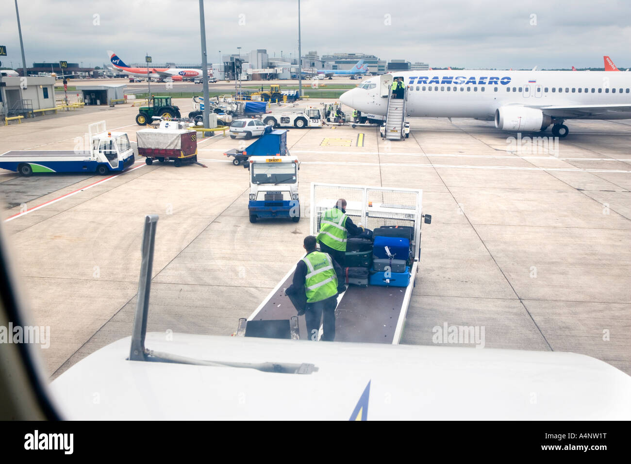 Baggage handlers at Gatwick airport London England Stock Photo