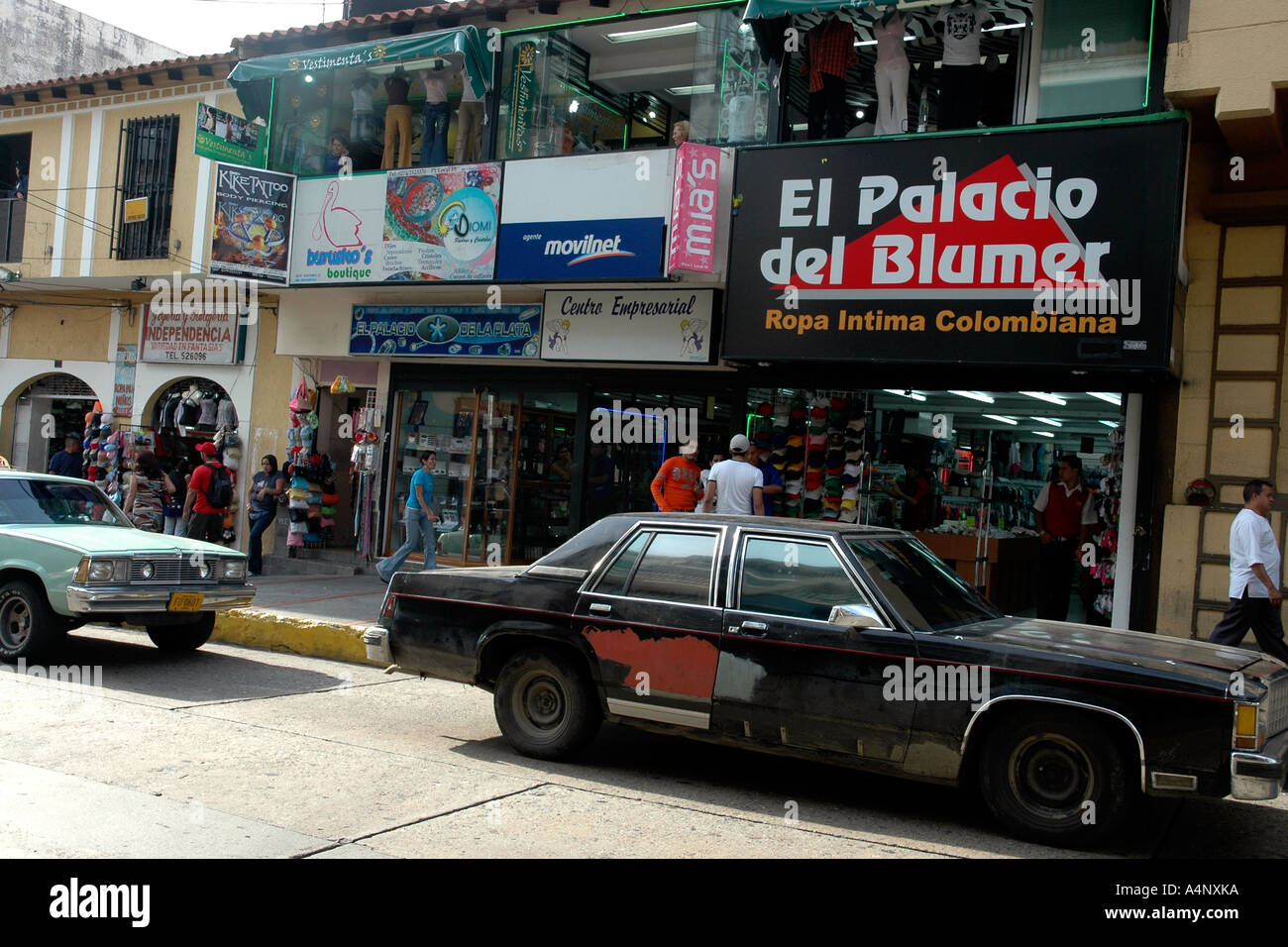 Shops in busy downtown Mérida, Venezuela, and one of the popular old  American cars Stock Photo - Alamy