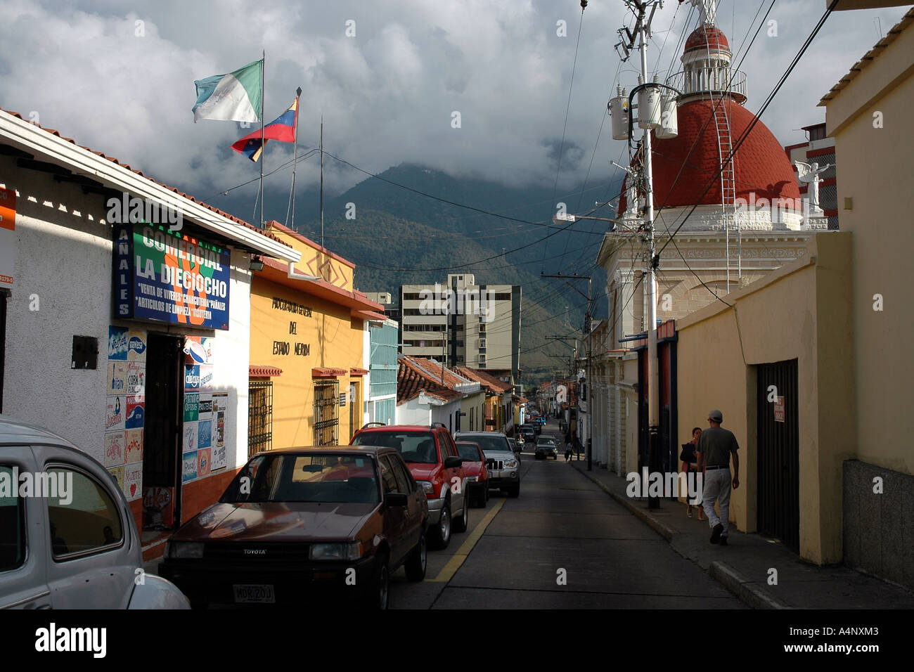 A street of offices, residences, a church in the historic centre of Mérida, Venezuela, with Andes foothills for backdrop Stock Photo