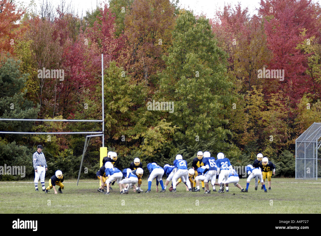 Middle School football action ages 12 to 14 male players Stock Photo