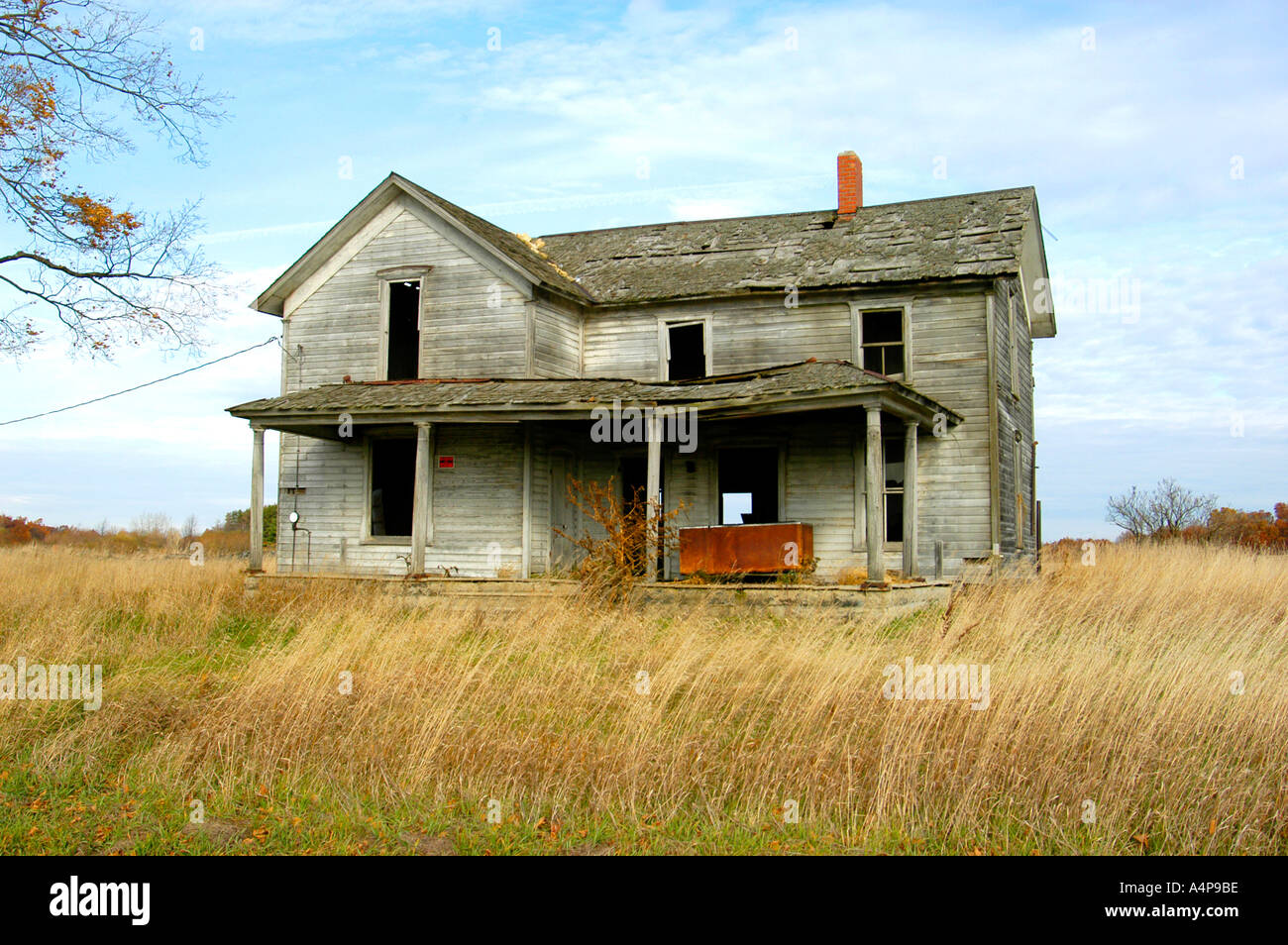 Old abandoned farm house during autumn Stock Photo