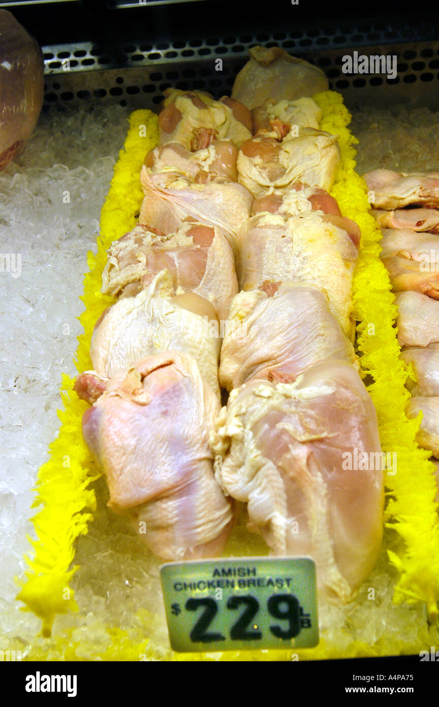 Fresh red meat fish vegetables fruit and poultry on display in a meat