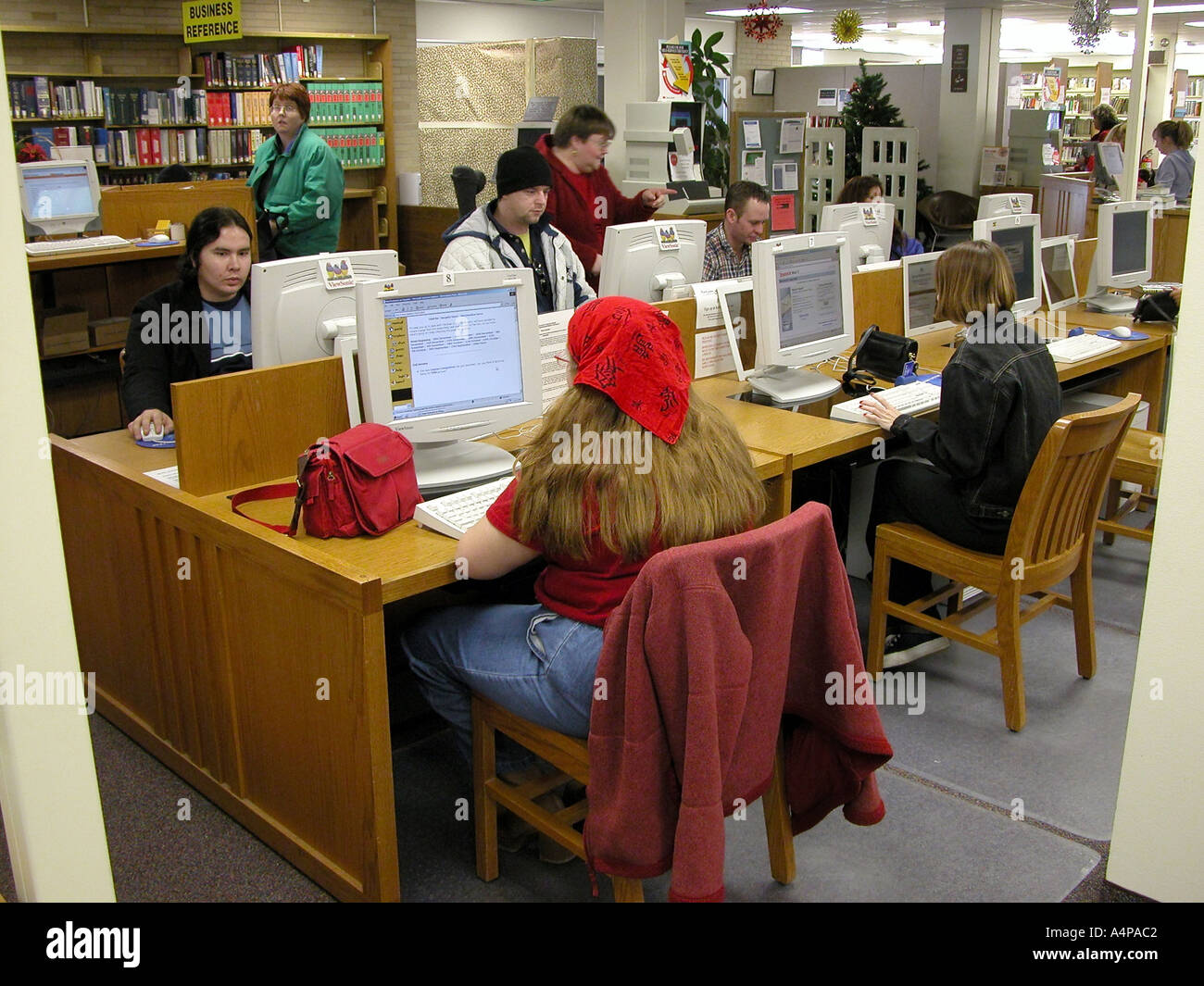 Community use computers at a public library to use the internet Stock ...