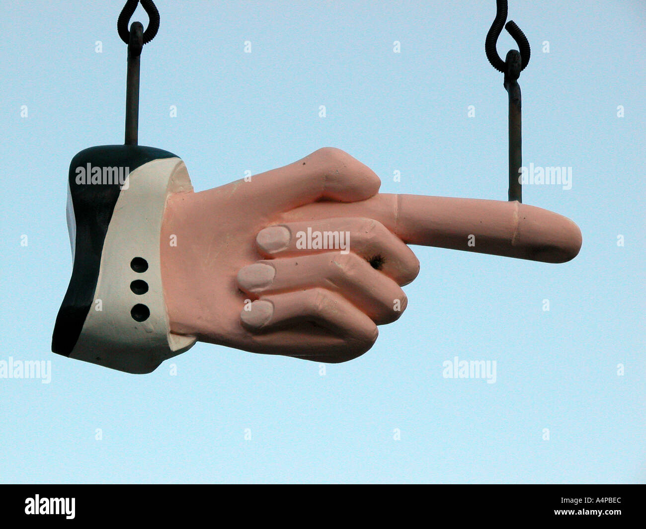 Unique sign with a hand with a pointing to washrooms Stock Photo - Alamy