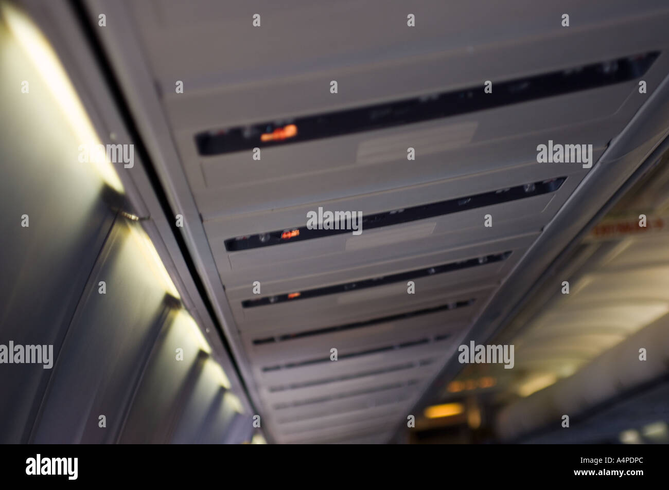 Overhead storage lockers on an airplane Stock Photo Alamy