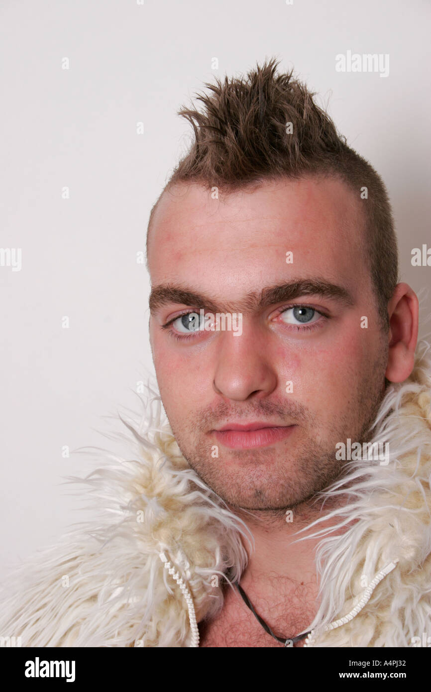 Mohican hair cut young man age between 20 and 25 wearing a fur coat shot in the studio on a white background Stock Photo - Alamy Mohican hair cut young man age between 20 and 25 wearing a fur coat shot in the studio on a white background Stock Photo - Alamy