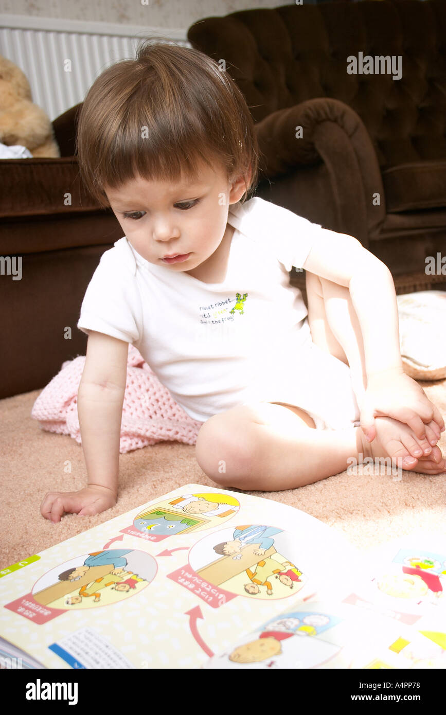 Young boy looking at book Stock Photo