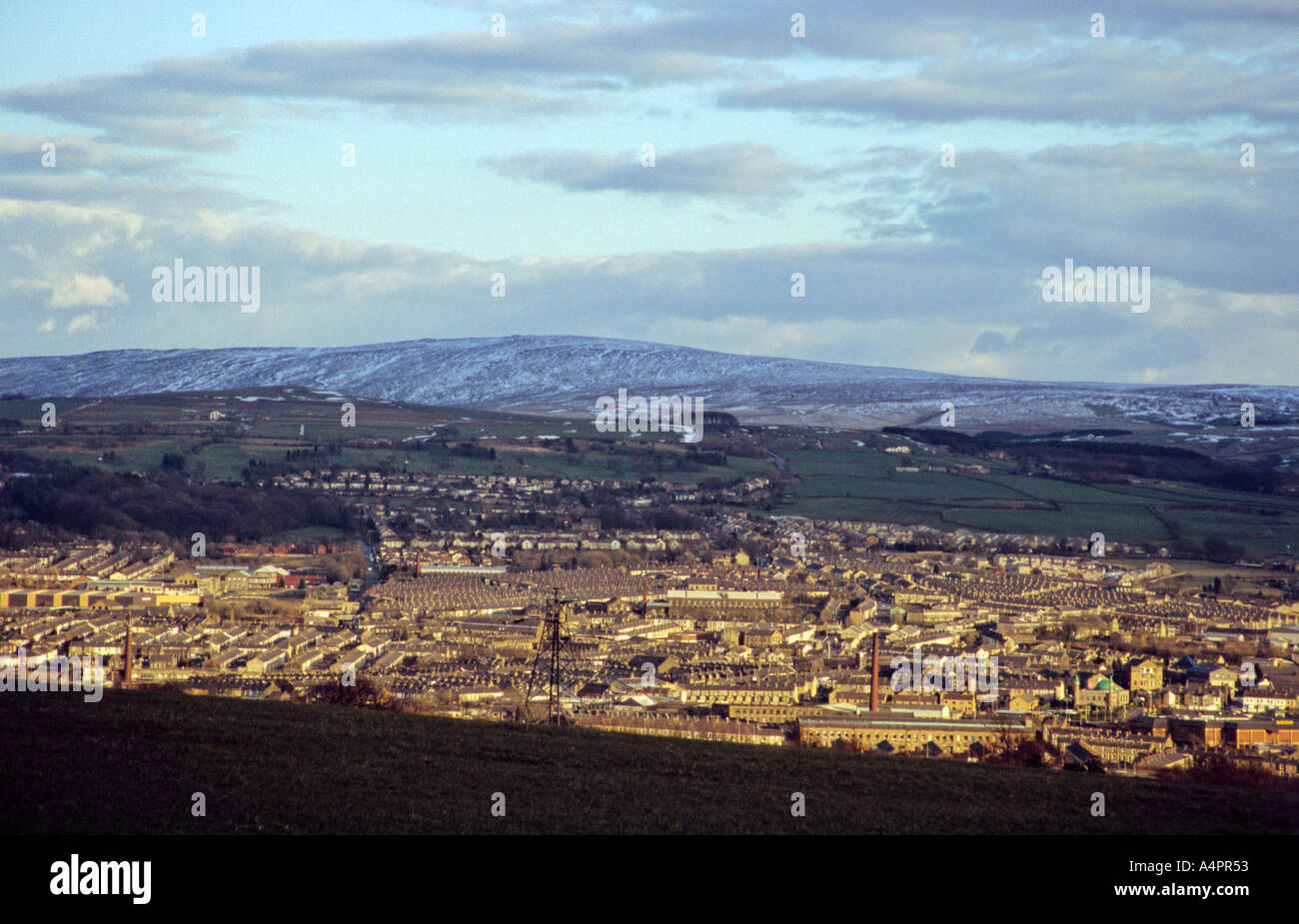 East lancashire town of Nelson with Boulsworth Hill in the distance. Stock Photo