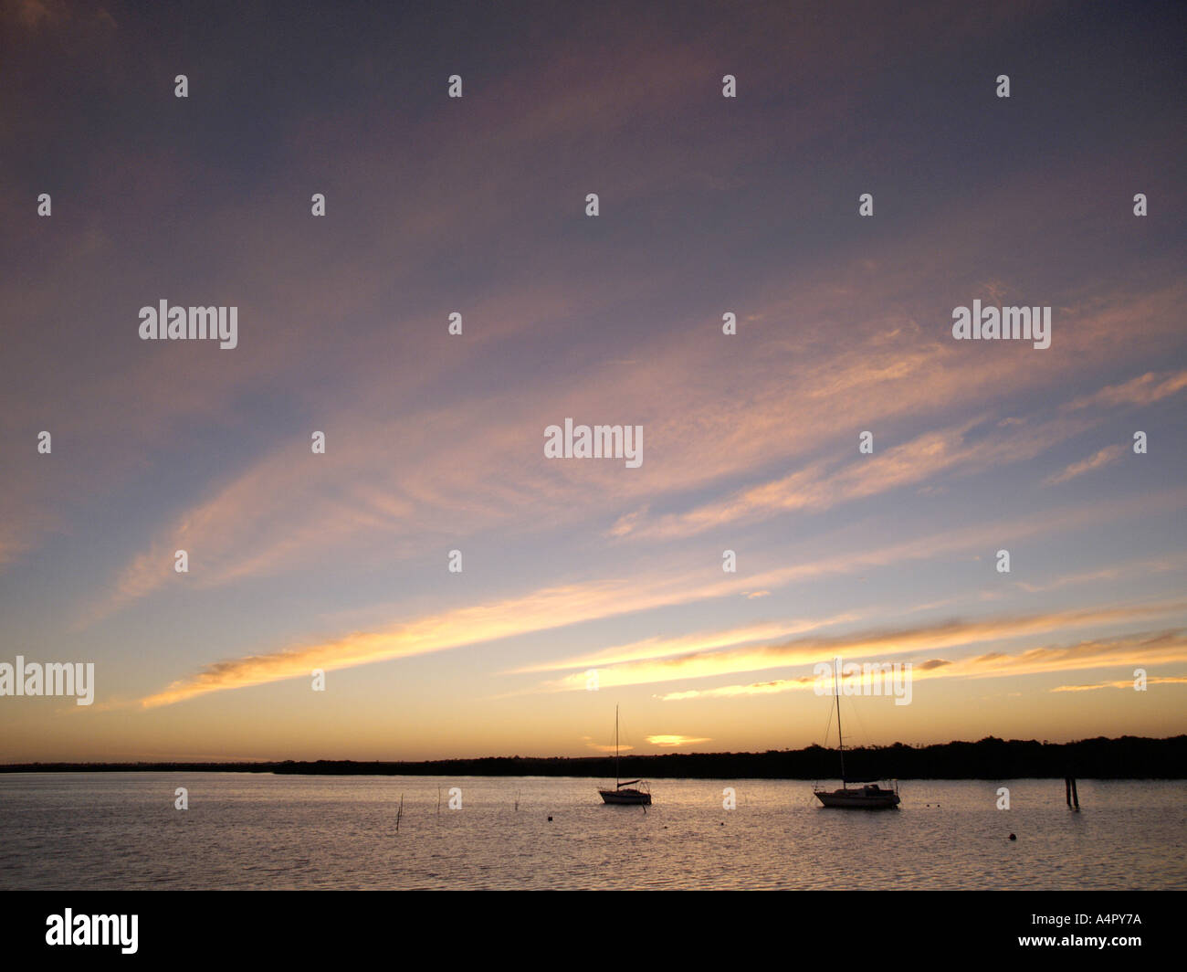 EVENING DUSK LIGHT WITH BOAT ON JETTY PORT BROUGHTON YORKE PENINSULAR SOUTH AUSTRALIA Stock Photo