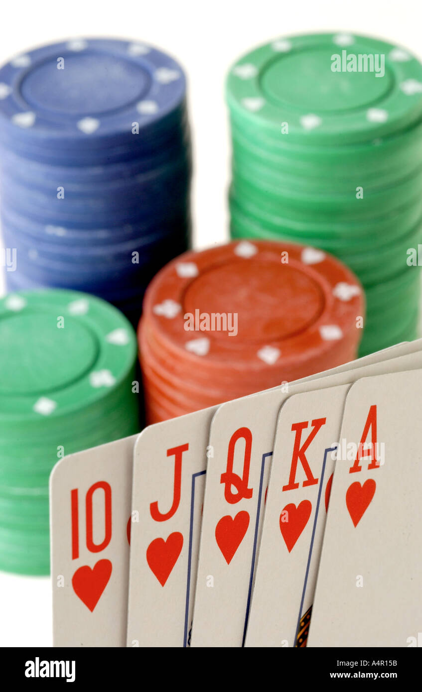 Color image showing a royal flush and a stack of poker chips Stock