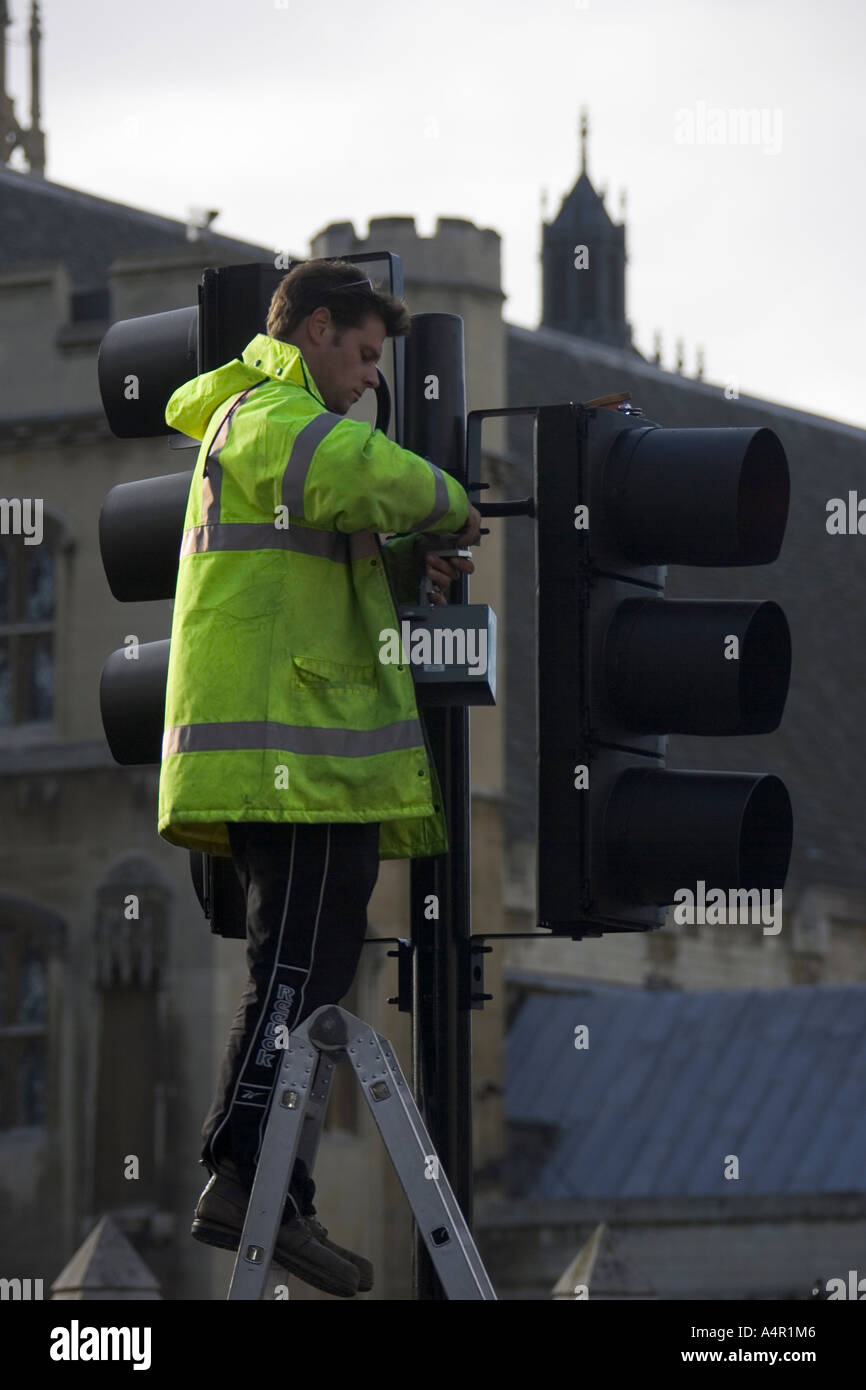 Side profile of a technician repairing a traffic light Stock Photo Alamy