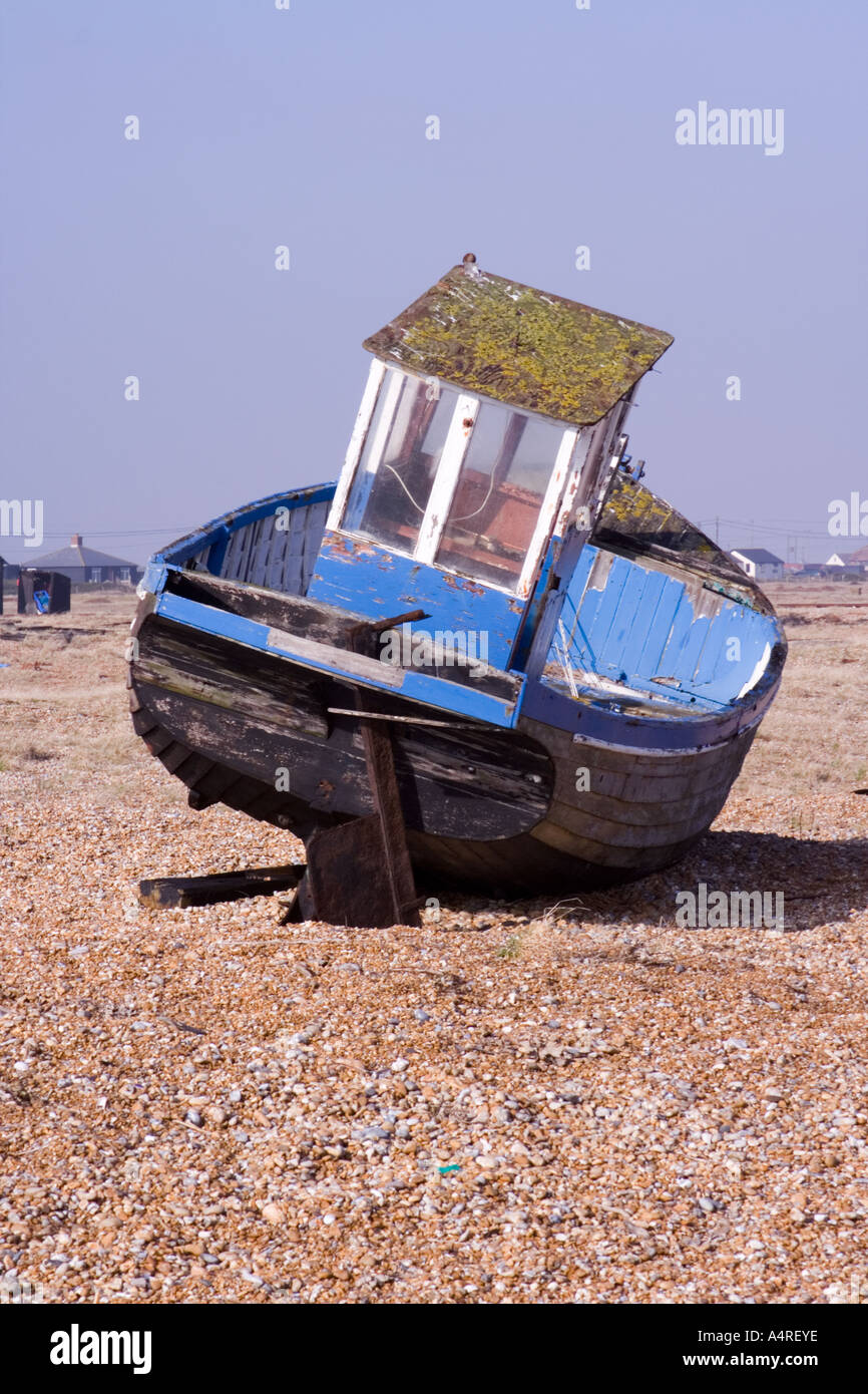 Back of an abandoned fishing boat on the shingle beach at Dungeness in ...