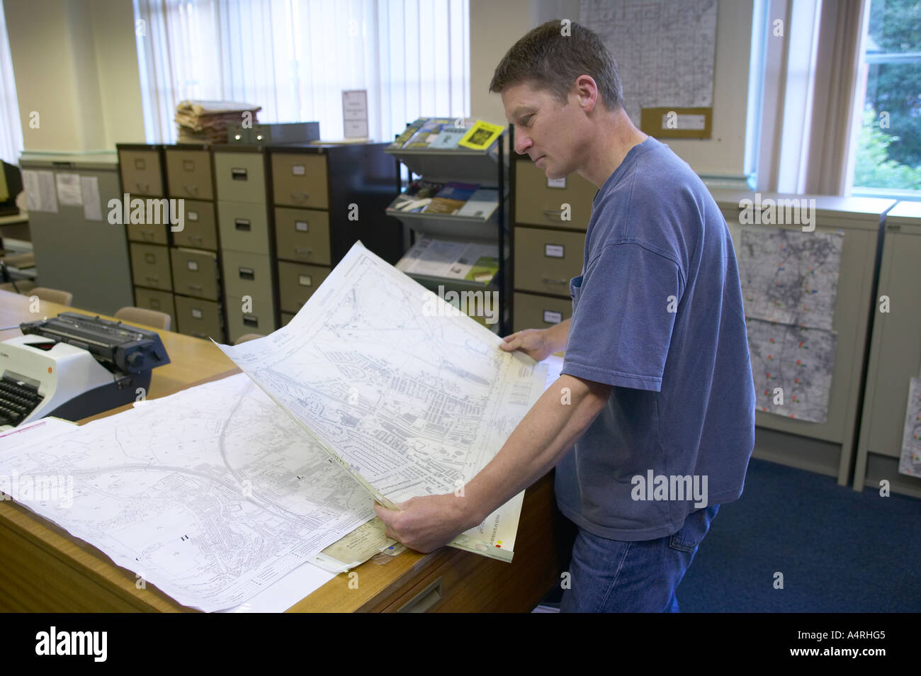 man studying a detailed map of his local area Stock Photo