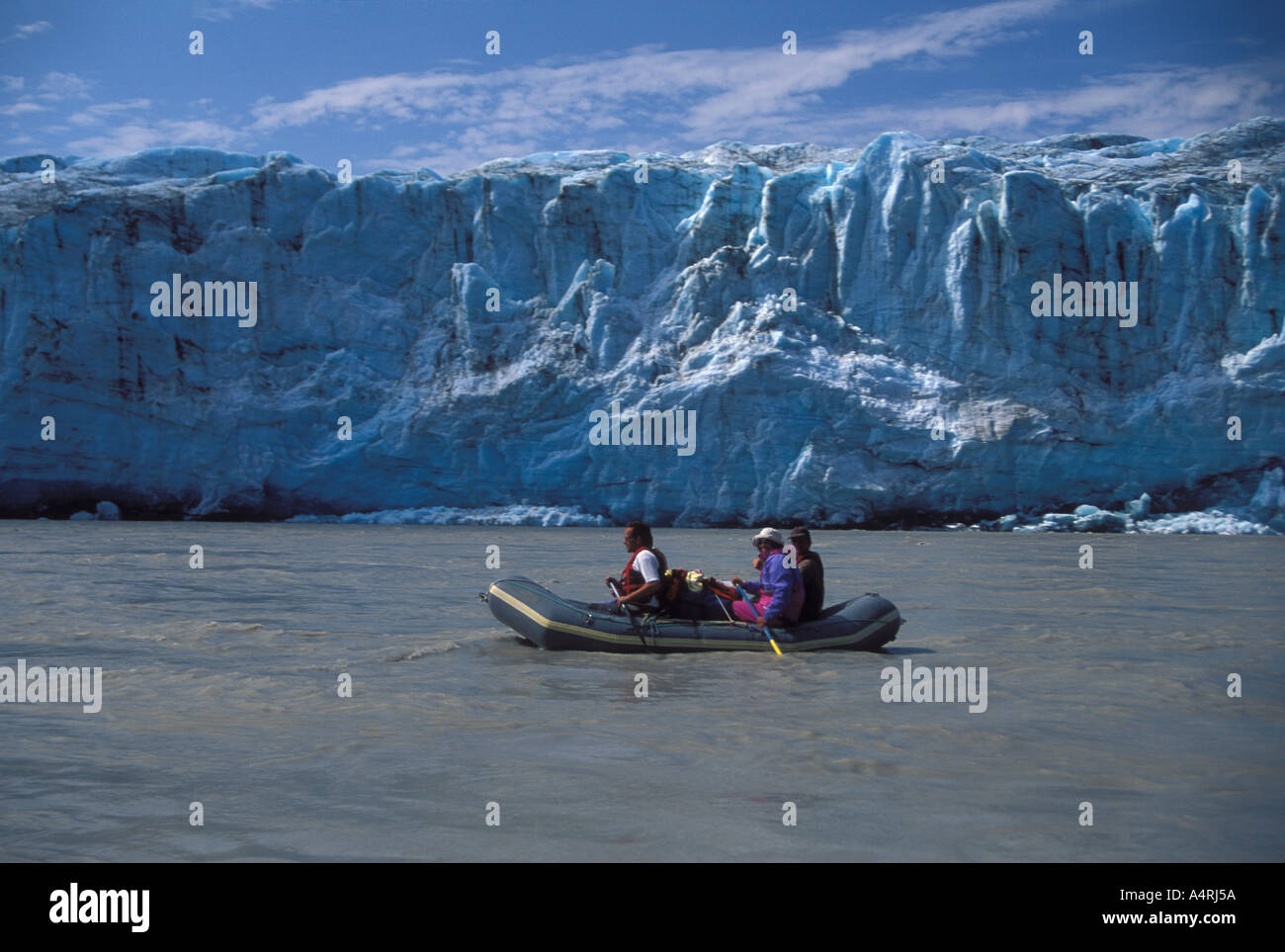 Raft passing icefall of Child glacier on Copper river Chugach Mountains ...