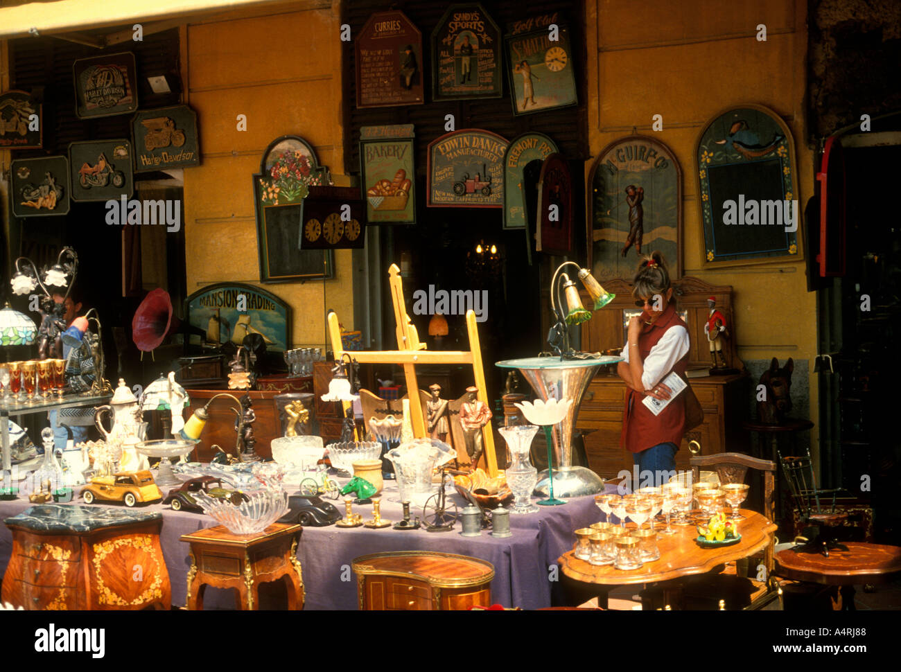 French woman, antique vendor, antique seller, selling antiques, antique