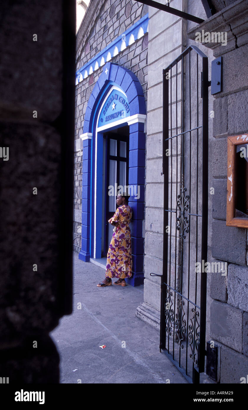 Young woman attending Sunday Mass on Our Lady of the Assumption