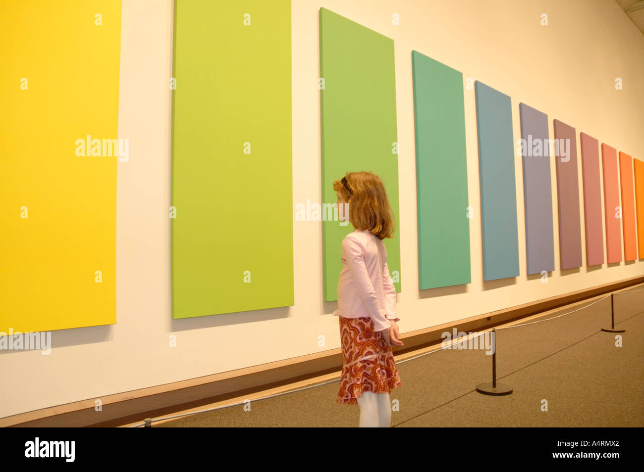 Young girl looking at art piece by Ellsworth Kelly, Metropolitan Museum of Art, New York Stock Photo