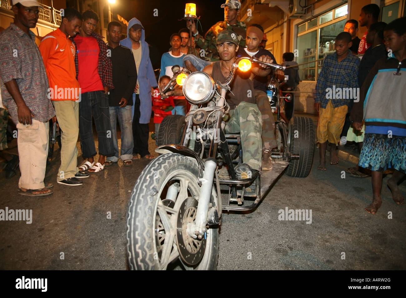 Bikers parade around the streets of Mindelo on a tandem during the annual Carnival 2007 Stock Photo