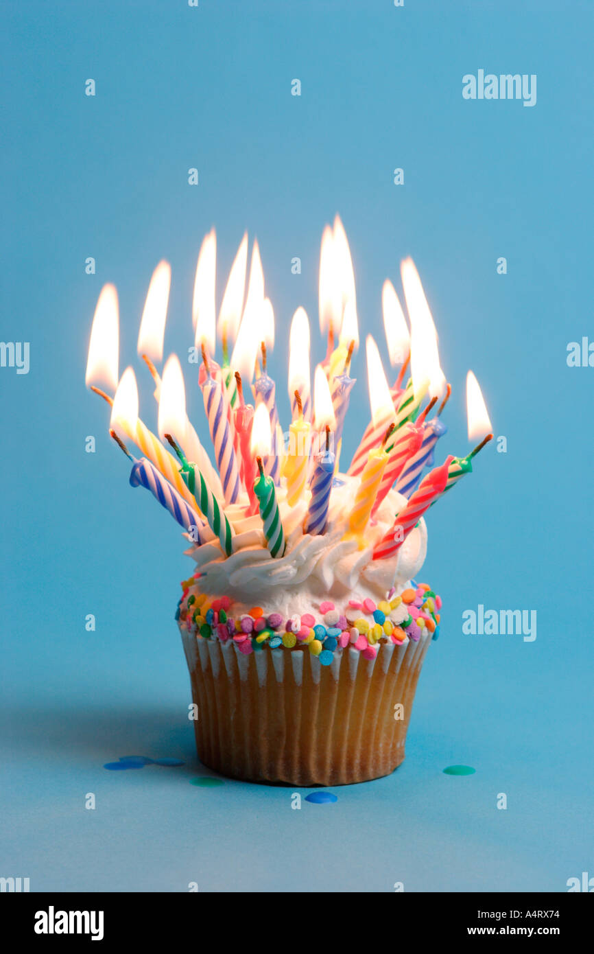 birthday-cupcake-with-lots-of-burning-candles-A4RX74.jpg