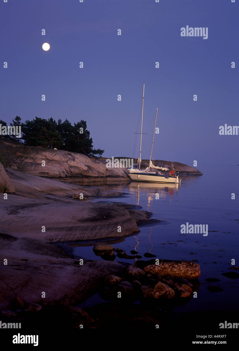 sailing yacht in the archipelago of Stockholm Sweden in moonlight Stock Photo