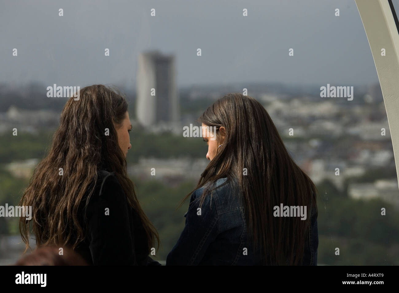 Rear view of two young women Stock Photo - Alamy