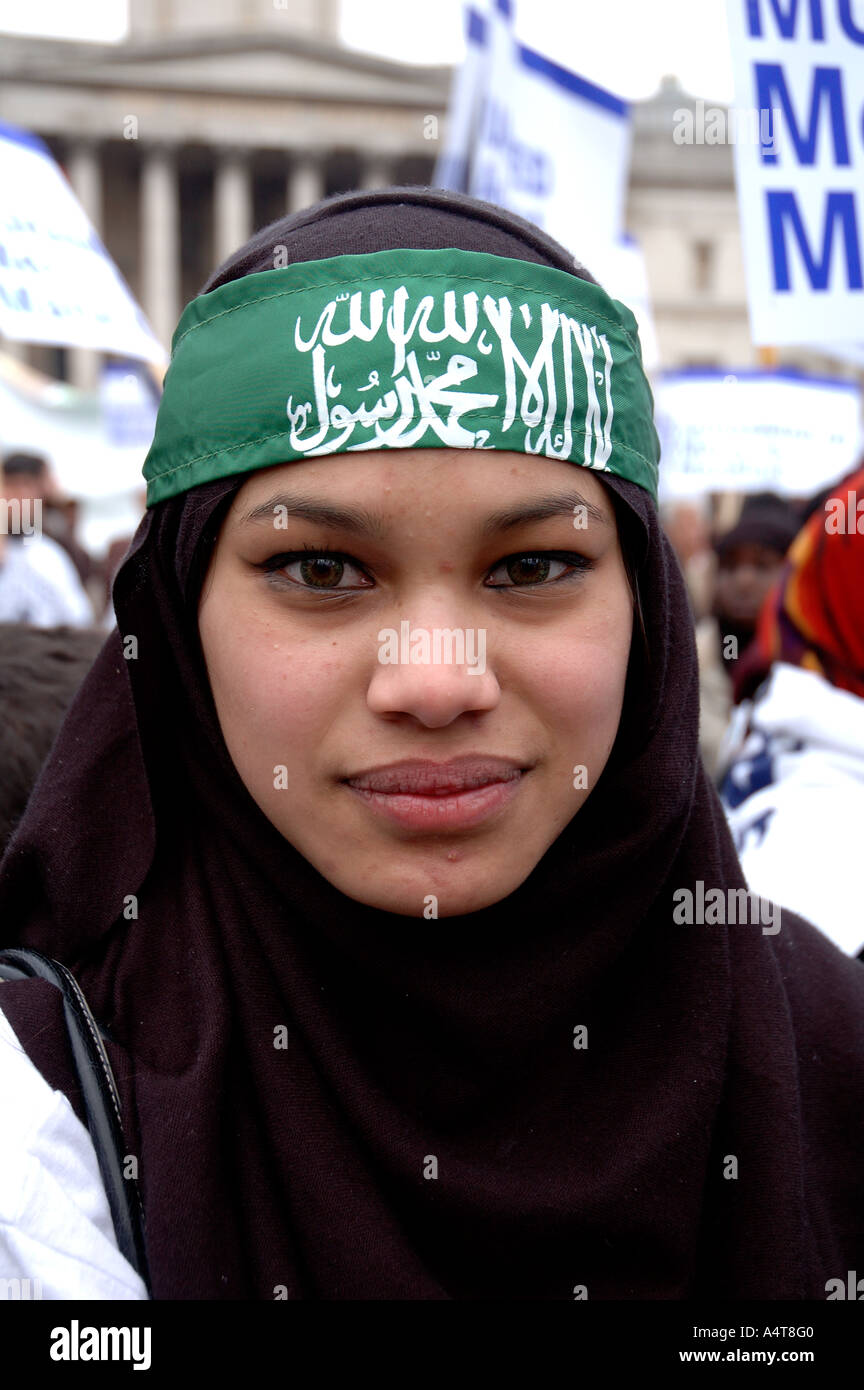 Muslim woman with Hamas headband demonstrating  in Central London  protesting against Islamophobia and incitement to racial hatr Stock Photo