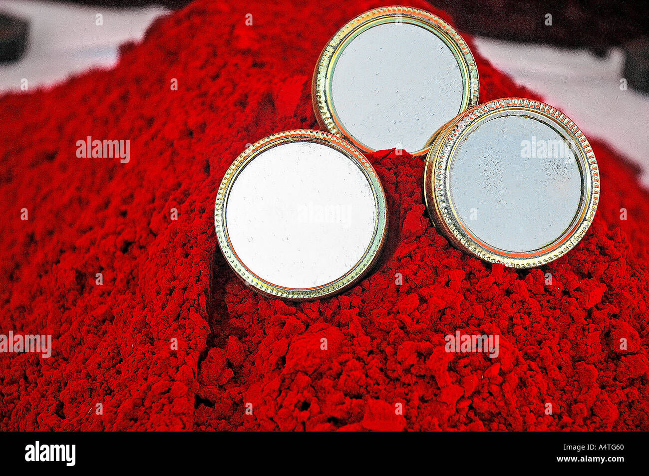 SUB98596 red coloured rangoli and three mirrors Pushkar Rajasthan India Stock Photo