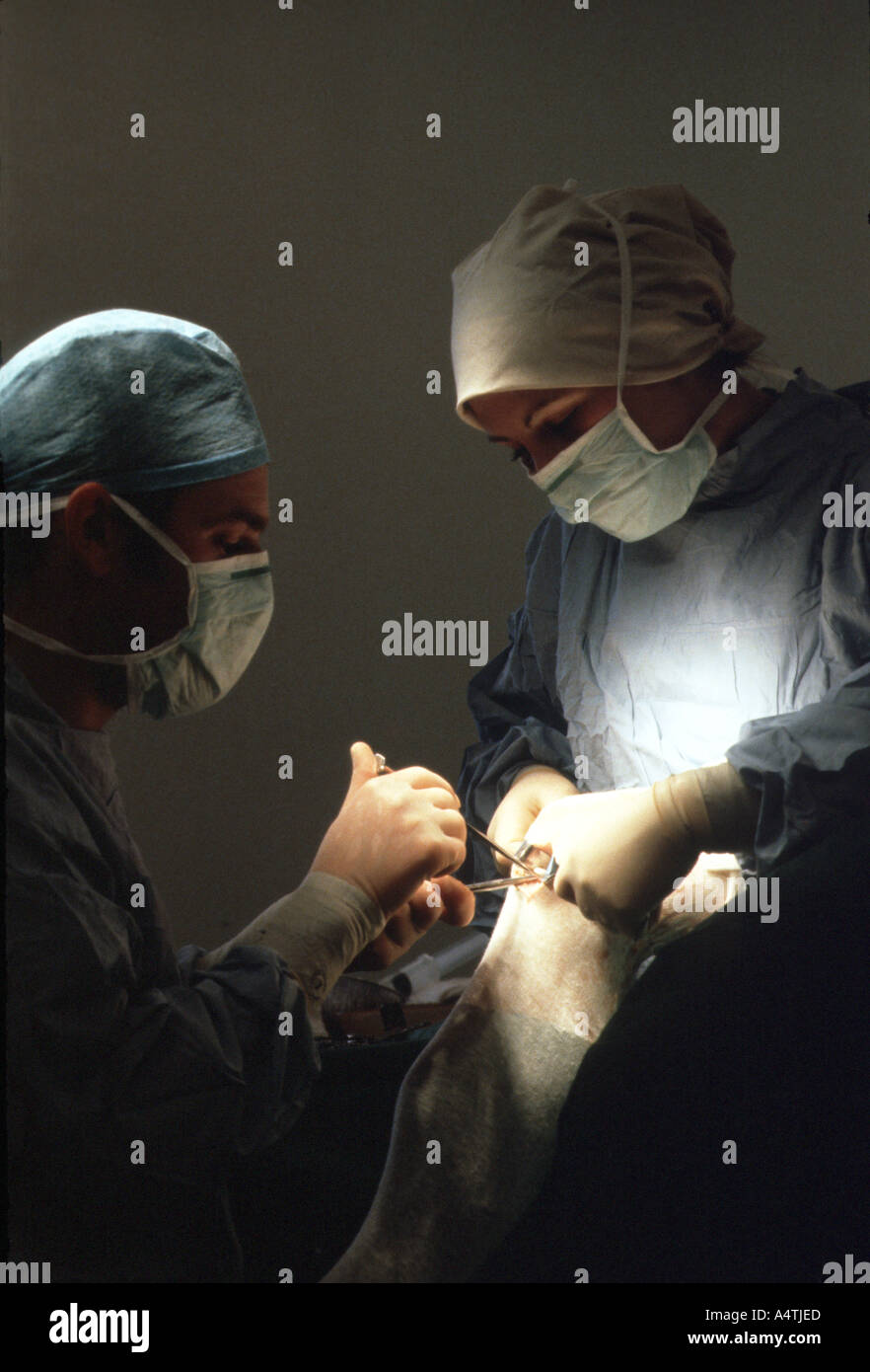 Surgeons in an operating theatre Stock Photo