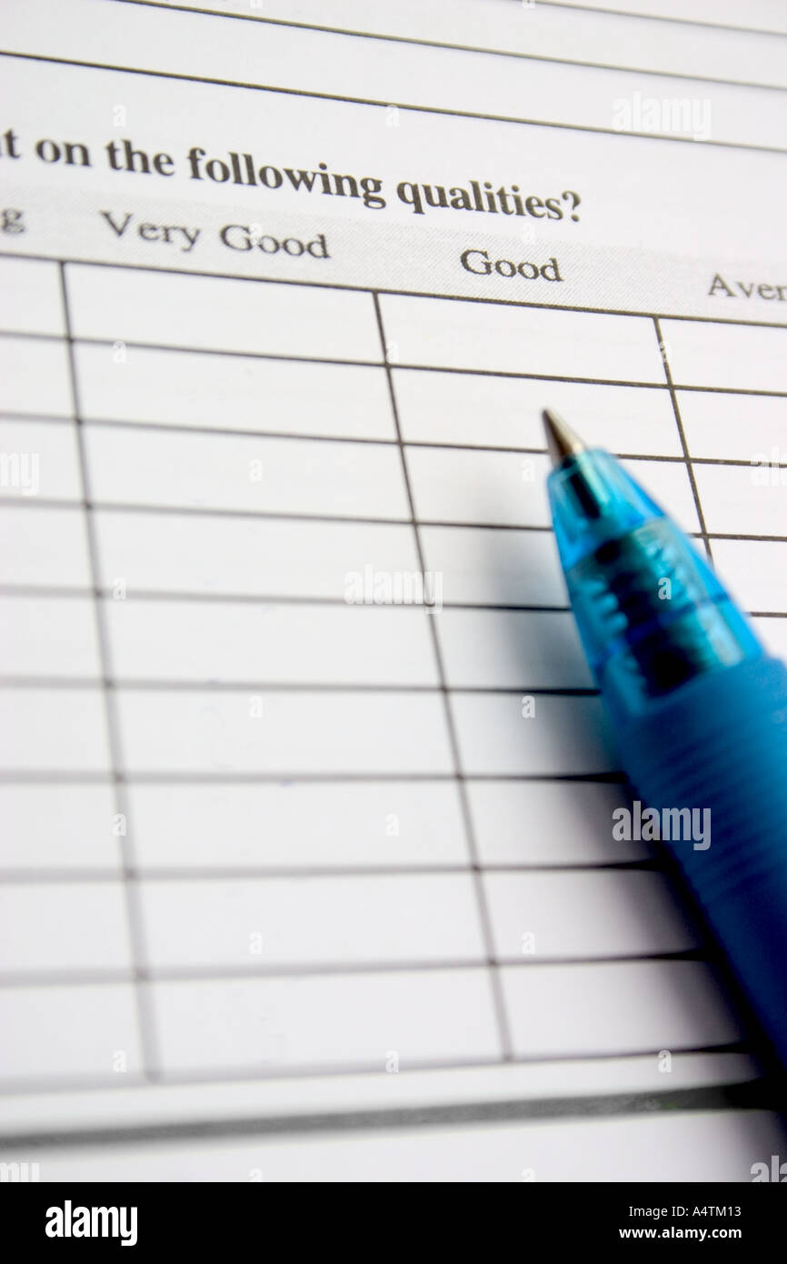 pen on empty survey form with words very good good average Stock Photo
